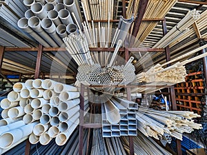 Many PVA Pipes Stacked in Building Supply Warehouse photo
