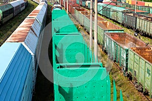 Many rail cars top view, going into