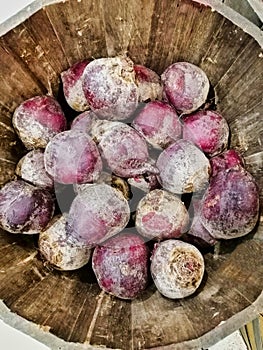 Many Raw Beetroot Bulbs in Wooden Cask