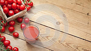 Many red cherry tomatoes on wooden table