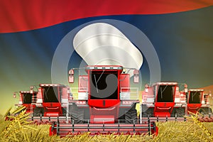 Many red farming combine harvesters on rye field with Lao People Democratic Republic flag background - front view, stop starving