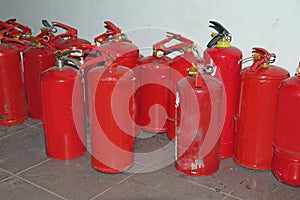 Many red fire extinguishers