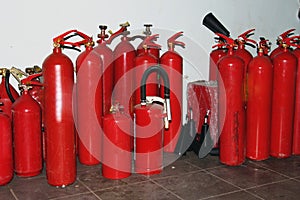 Many red fire extinguishers