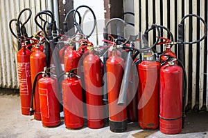 Many red fire extinguishers
