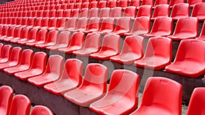 Many red plastic seats grandstand stadium