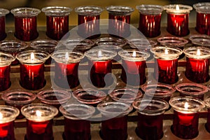 Many red votive candles