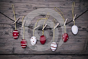 Many Red And White Easter Eggs Hanging On Line With Frame