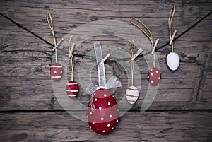 Many Red And White Easter Eggs And One Big Egg Hanging On Line Frame