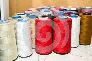 Many reels of threads standing on the table