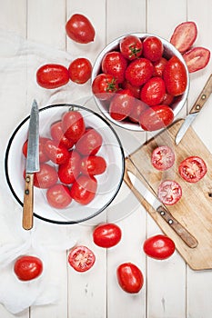 Many ripe red tomatoes on the wooden table