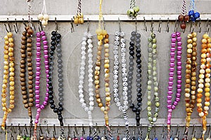 Many rosaries in various colors