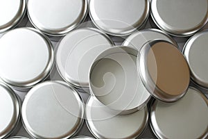 Many round tin boxes