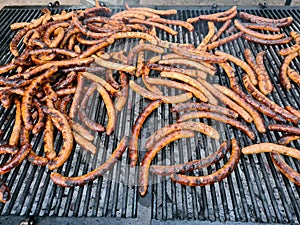 many sausages on the grill