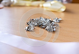 Many seamstress elements on a clear wooden background