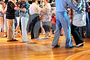 Many senior couples in love dancing