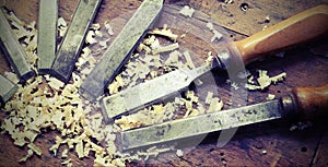 sharp chisels with sawdust and vintage effect photo