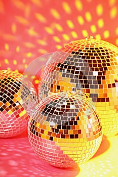 Many shiny disco balls on pink