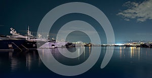 Many ships at night on the pier in the Aegean Sea Athens Greece