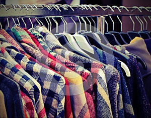 Many shirts for sale in the used clothes market