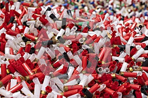 Many shotgun shells of various colors with empty fired cartridges , Can be used as a texture background