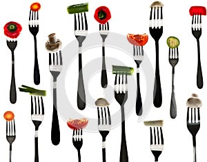 Many slice of vegetables in forks