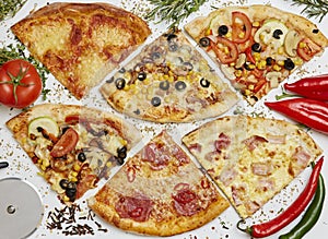 Many slices of fresh pizza