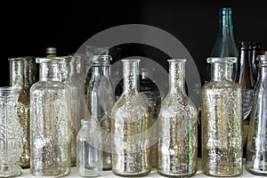 Many small glass medical bottles.