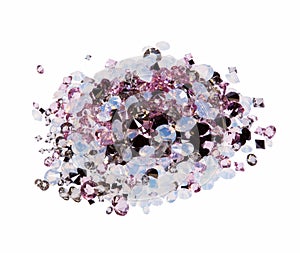 Many small purple diamond jewel stones heap isolated.