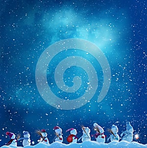 Many snowmen snowmen go in winter Christmas landscape