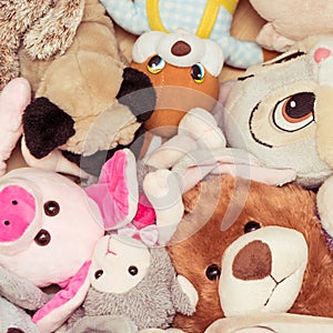 Many soft plush toys lie on floor in the children`s room