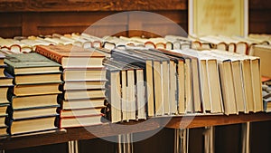 Many stacks of books on table in book store, library. Education, school, reading concept