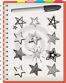 Many star shapes on notebook isolated on white background