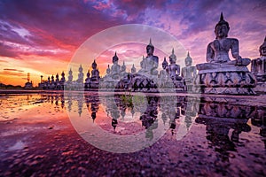 Many Statue buddha image at sunset in southen of Thailand