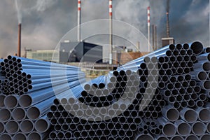 Many steel pipes stacked. Metallurgy industry concept. 3D rendered illustration.