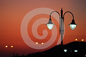 Many of streetlamp at sunset