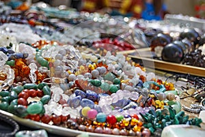 Many strings of colorful beads made of natural stones