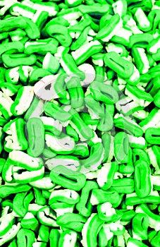 Many sugar jelly candies as many green white teets