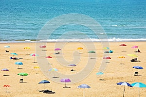 Many sunshade umbrellas on the sea beach resort