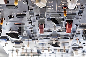 Many switches in an aircraft cockpit.