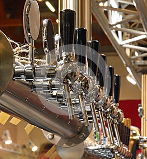Many taps in stainless steel to draught beer
