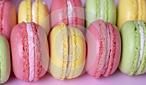 Many tasty macarons background, close up. French concept