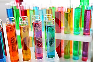 Many test tubes with colorful liquids, closeup