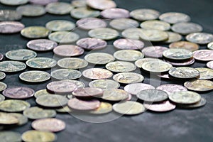 Many Thai coins on the cement floor