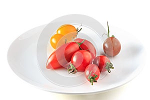 Many tomato on the white plate