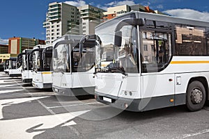 many tourist buses at the bus station