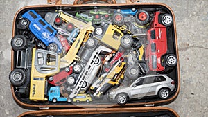 - Many toy cars. Photos of toy cars in the suitcase