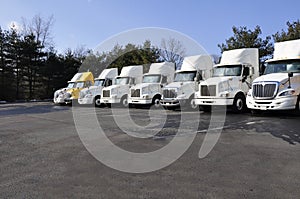 Many tractor trailers photo