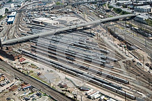 Many trains waiting on the railroad tracks in the city. View from the top.