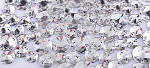 Many transparent sewn stones on a white background