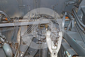 Many tubes of the hydrodynamic system of the aircraft. Painted with gray paint with traces of peeling